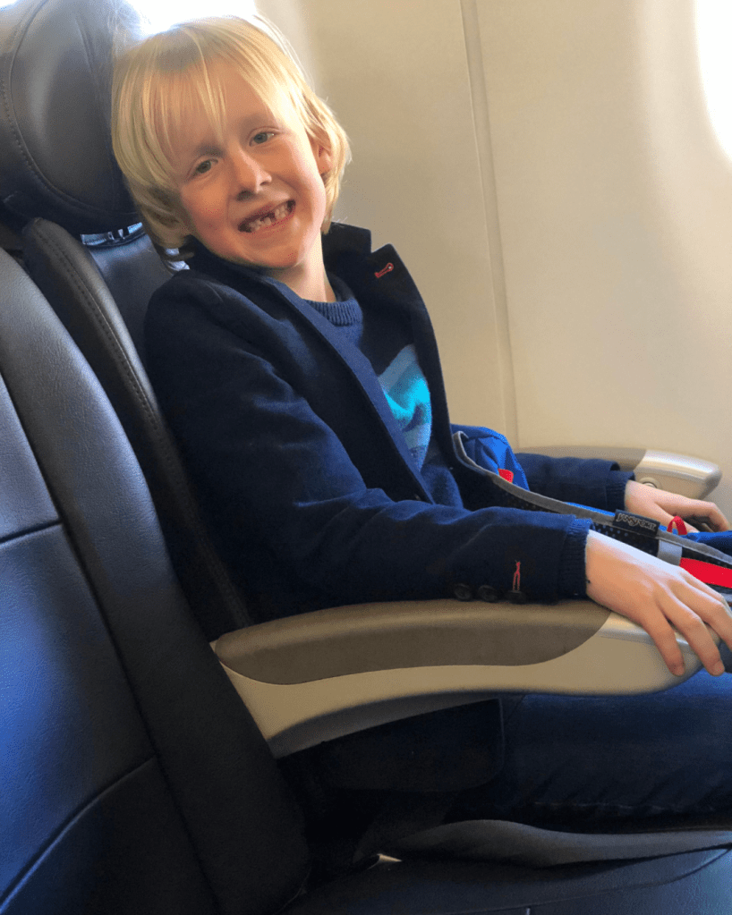 Boy ready for his next big travel adventure